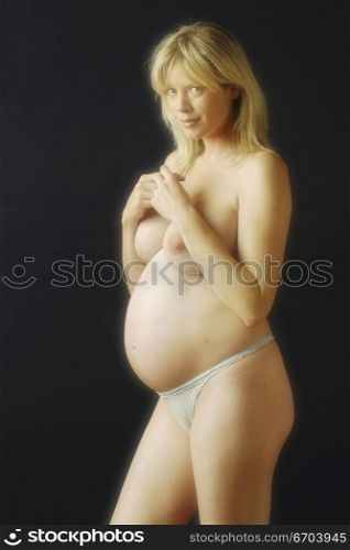 A nude image of a young pregnant mother.