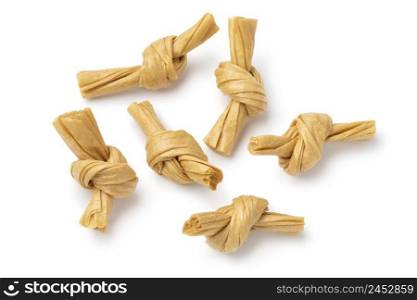 A number of uncooked bean curd knot isolated on white background close up