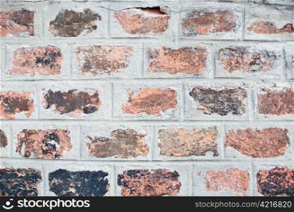a old and aged brickwall which consists of many different colors