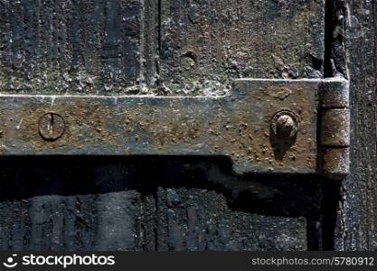 a old iron metal lock screw and wood in the centre of colonia del sacramento uruguay