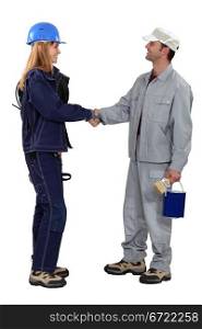 A painter and an electrician shaking hands.