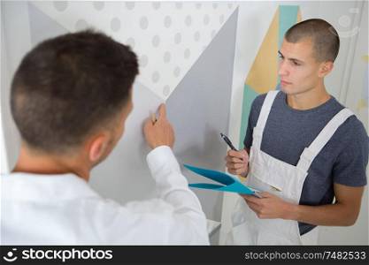 a painter with an apprentice