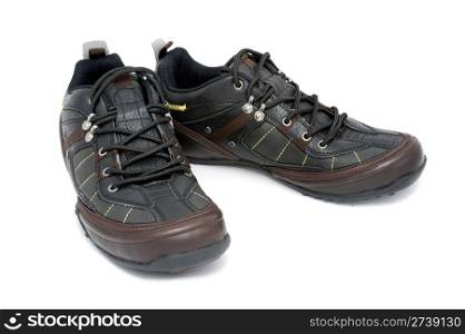 a pair of black mens sports shoes over white background