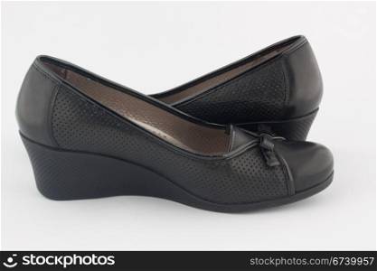 a pair of black platform shoes