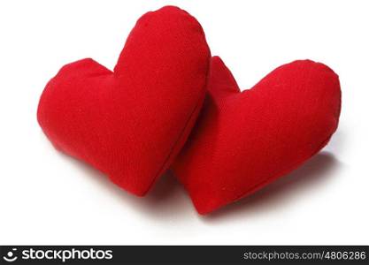 A Pair Of Fabric Red Hearts Isolated On White Background