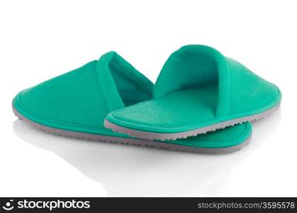 A pair of green slippers on a white background.