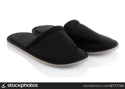 A pair of grey slippers on a white background.