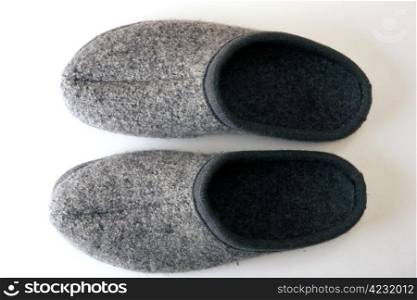 A pair of men&rsquo;s sllippers isolated on white background