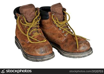 A pair of mens work boots scuffed along the toes. Isolated with a clipping path.