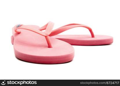A pair of pink sandals on white background