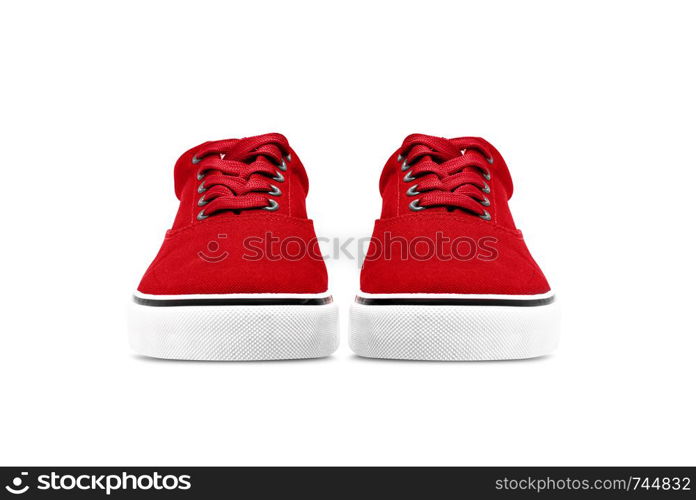 A pair of Red canvas shoes isolated on white background with clipping path. A pair of green canvas shoes isolated on white