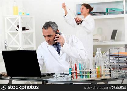 A pair of scientists conducting an experiment