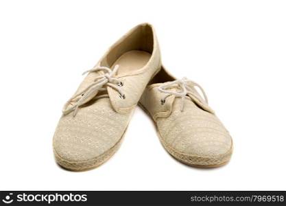 A pair of summer shoes beige lace and fabric. Isolate on white.