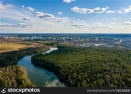 A panorama of the city of Ivanovo with the Kharinka river from a bird&rsquo;s flight on a spring cloudy day, photo taken from a quadrocopter.