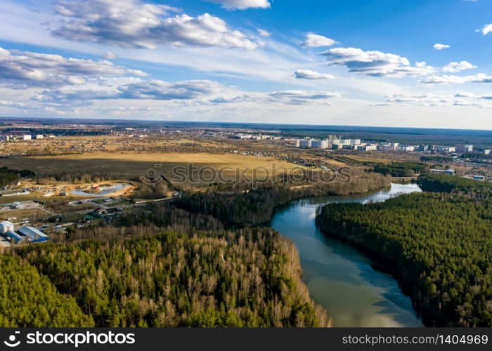 A panorama of the city of Ivanovo with the Kharinka river from a bird&rsquo;s flight on a spring cloudy day, photo taken from a quadrocopter.