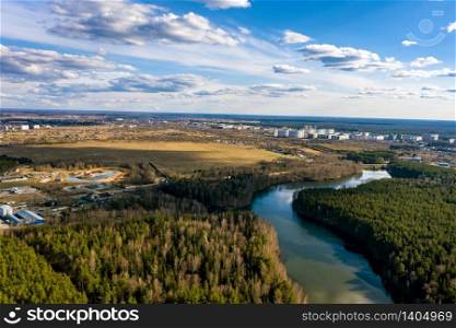 A panorama of the city of Ivanovo with the Kharinka river from a bird&rsquo;s flight on a spring cloudy day, photo taken from a quadrocopter.
