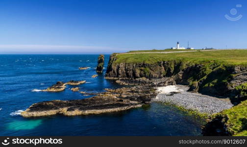 A panorama view of the wild Caithness coast and the Noss Head Lighthouse