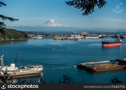 A panoramic shot of the Port of Tacoma with majestic Mount Rainier in the distance.