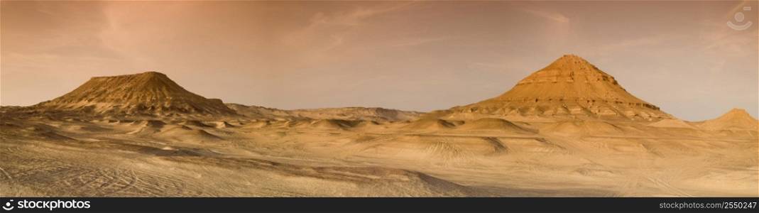 A panoramic stock photograph of the Black Desert in Egypt.