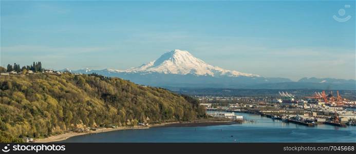 A panoramic view of majestic Mount Rainier towering over the Port of Tacoma.