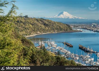 A panoramic view of Mount Rainier, The Port of Tacoma and a marina.