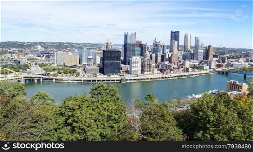 A panoramic view of the downtown area of the city of Pittsburgh from across the Mononghela River.
