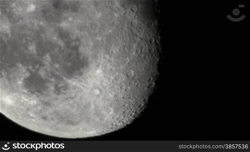 a partial moon video shot through a telescope