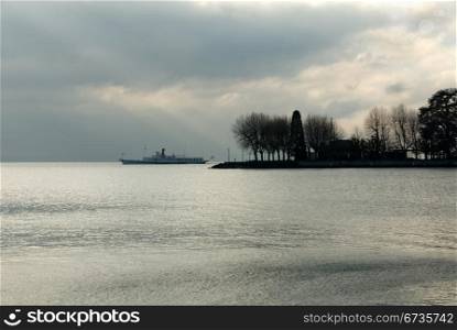 A passenger ferry on Lac Leman, near Geneva, Switzerland, on a cold, dull, winter&rsquo;s day.