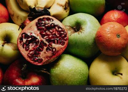 A passion fruit over other fruits, healthy food spring style concept shot