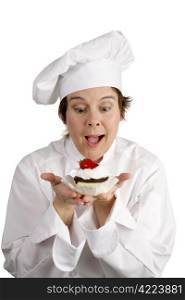 A pastry chef excited about a strawberry cheesecake tart she has just made. Isolated on white.
