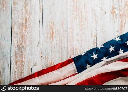A patriotic Veterans Day scene, American flags on a wooden background, symbolizing honor, pride, and democracy. November 11 is a day to celebrate our nation&rsquo;s heroes.