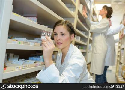 a pharmacist checking the medication