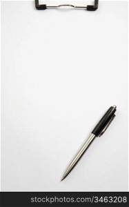 a photo of a Clipboard and pen over white background