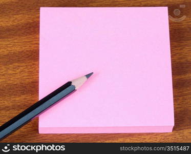 a photo of a Post-It and pencil on the table