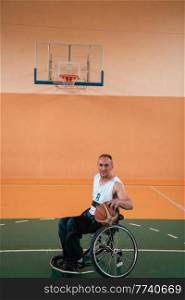 a photo of a war veteran playing basketball in a modern sports arena. The concept of sport for people with disabilities. High quality photo. a photo of a war veteran playing basketball in a modern sports arena. The concept of sport for people with disabilities