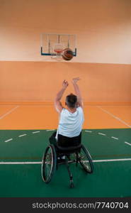 a photo of a war veteran playing basketball in a modern sports arena. The concept of sport for people with disabilities. High quality photo. a photo of a war veteran playing basketball in a modern sports arena. The concept of sport for people with disabilities