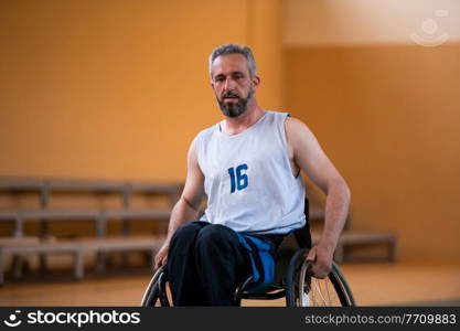 a photo of a war veteran playing basketball with a team in a modern sports arena. The concept of sport for people with disabilities. High quality photo. a photo of a war veteran playing basketball with a team in a modern sports arena. The concept of sport for people with disabilities