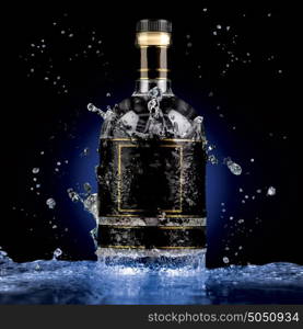 A photo of luxury alcohol bottle in water splash.
