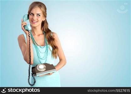 A photo of the smiling girl with vintage phone.