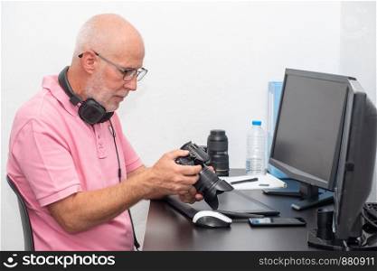 a photographer and camera at office with computer