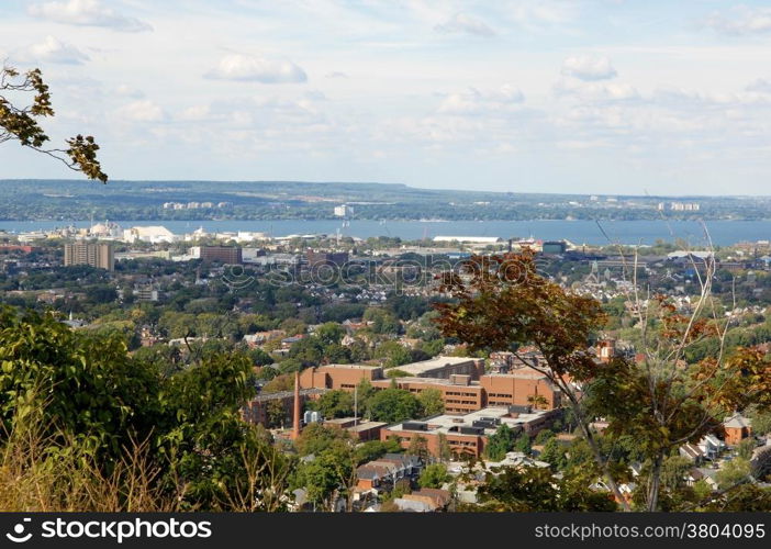 A picture of the lower city of Hamilton from the mountain,&#xA;with the harbour in the background.&#xA;