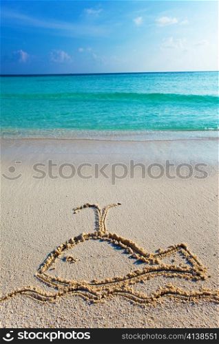 a picture on sand- whale