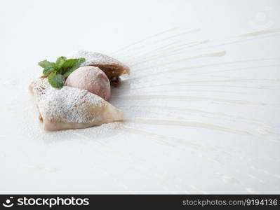 a piece of cake poured with sweet sauce over white background. cake on a white background