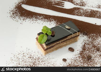 a piece of cake with sprinkled with powdered sugar on a white background. cake on a white background