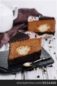 A piece of chocolate cake with tea