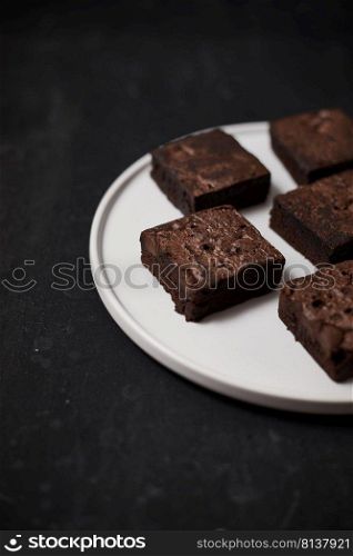 A piece of homemade chocolate brownies, sweet and dessert. 