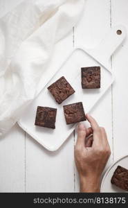 A piece of homemade chocolate brownies, sweet and dessert. 