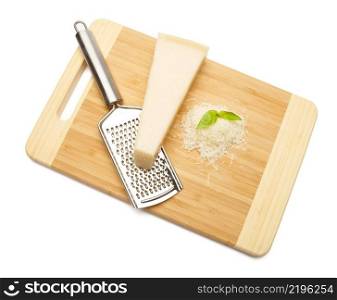 a piece of italian Parmesan and grated cheese on cutting board white background. a piece of Parmesan and grated cheese on cutting board white background