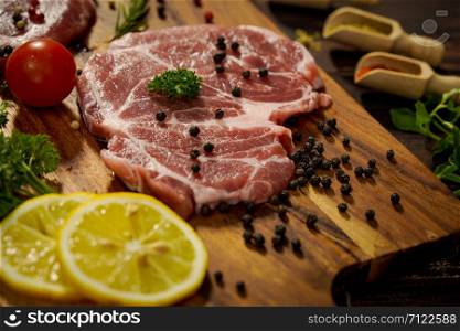 A piece of meat is prepared for making a steak for the family dinner.Steak and ingredients prepared for the evening party