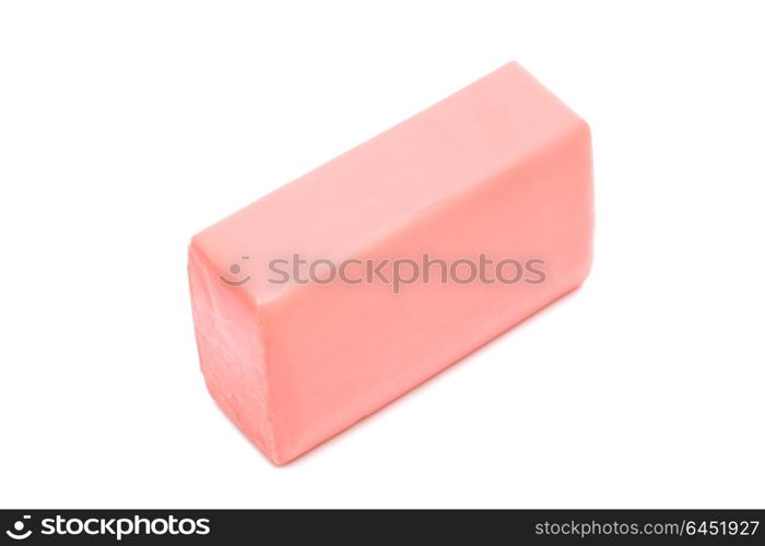 a piece of pink soap on a white background